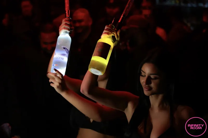 Bottles carried through the crowd with sparklers lit.